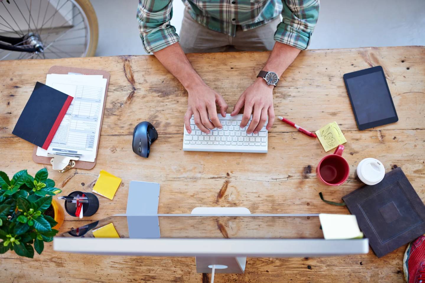typing on keyboard at desk